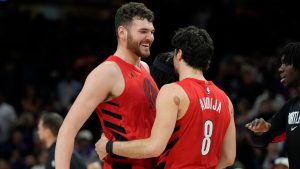 Portland Trail Blazers centre Donovan Clingan, left, celebrates a win against the Phoenix Suns with Blazers forward Deni Avdija (8) after an NBA play-in tournament basketball game, Tuesday, April 14, 2026, in Phoenix. (Ross D. Franklin/AP)