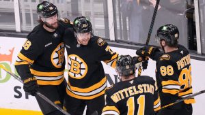 Boston Bruins left wing Viktor Arvidsson, center, is congratulated after his goal against Dallas Stars goaltender Jake Oettinger (29) during the first period of an NHL hockey game, Tuesday, March 31, 2026, in Boston. (Charles Krupa/AP)