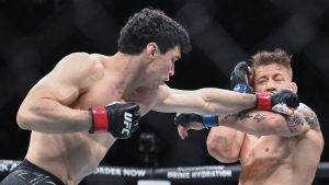 Mike Malott, left, lands a blow to Charles Radtke during their UFC 315 mixed martial arts welterweight bout in Montreal, Saturday, May 10, 2025. THE CANADIAN PRESS/Graham Hughes