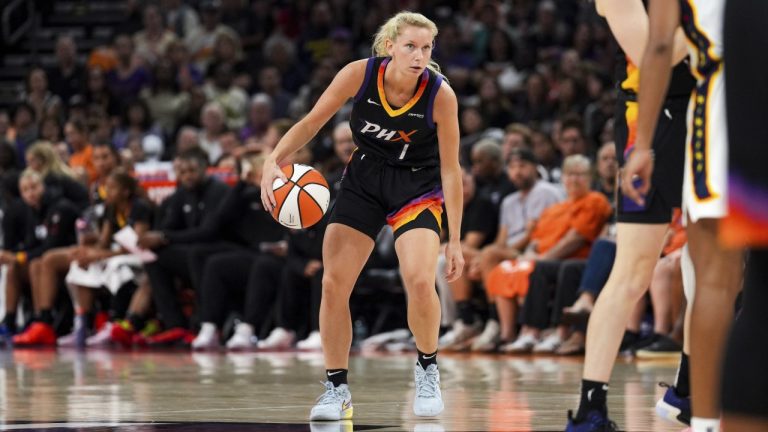 Phoenix Mercury guard Lexi Held (1) dribbles the ball during the second half of a WNBA basketball game against the Indiana Fever, Tuesday, Sept. 2, 2025, in Phoenix. (AP Photo/Samantha Chow)