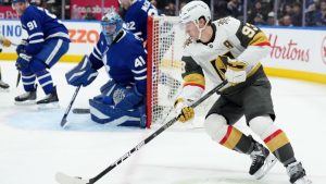 Vegas Golden Knights' Mitch Marner (93) tries a wrap around on Toronto Maple Leafs goaltender Anthony Stolarz (41) during third period NHL hockey action in Toronto on Friday, January 23, 2026. THE CANADIAN PRESS/Nathan Denette