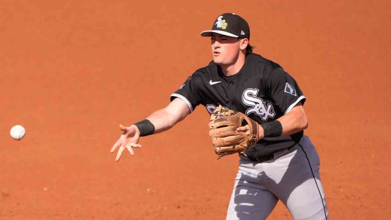 Chicago White Sox second baseman Sam Antonacci throws to first for the out on Seattle Mariners right fielder Dominic Canzone during the second inning of a spring training baseball game Tuesday, Feb. 24, 2026, in Peoria, Ariz. (Charlie Riedel/AP)