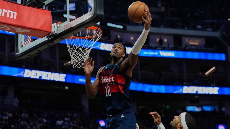 Washington Wizards centre Alex Sarr (20) rebounds the ball next to Golden State Warriors guard Gary Payton II, right, during the first half of an NBA basketball game, Friday, March 27, 2026, in San Francisco. (Godofredo A. Vásquez/AP)