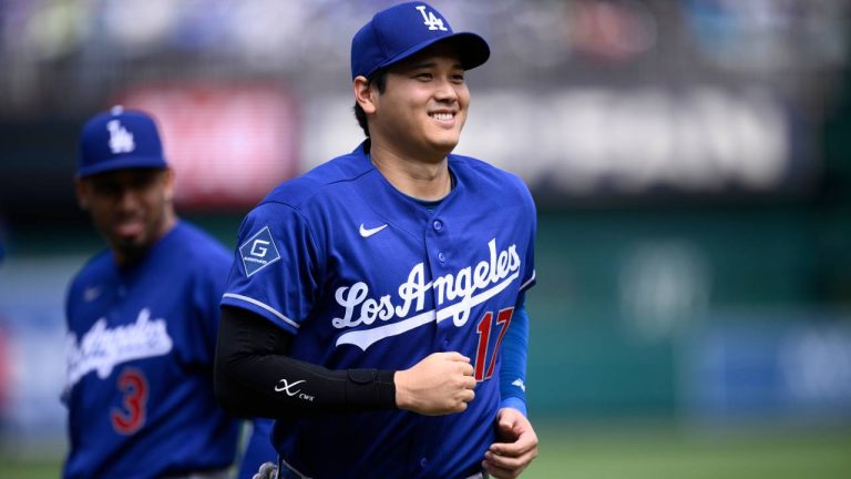 Los Angeles Dodgers designated hitter Shohei Ohtani (17) smiles during introductions before a baseball game against the Washington Nationals, Friday, April 3, 2026, in Washington. (Nick Wass/AP)
