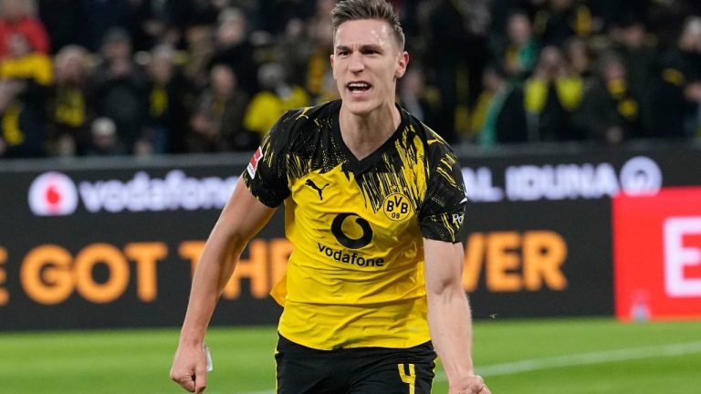 Dortmund's Nico Schlotterbeck celebrates after scoring the opening goal during the German Bundesliga soccer match between Borussia Dortmund and Werder Bremen in Dortmund, Germany, Tuesday, Jan. 13, 2026. (Martin Meissner/AP)