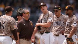 San Diego Padres pitcher Nick Pivetta, center, reacts before exiting during the fourth inning of a baseball game against the Colorado Rockies Sunday, April 12, 2026, in San Diego. (Gregory Bull/AP)