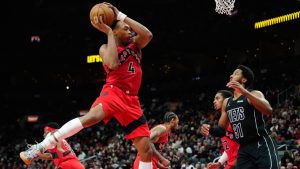 Toronto Raptors forward Scottie Barnes (4) grabs the rebound in front of Brooklyn Nets forward Chaney Johnson (31) during second half NBA basketball action in Toronto, Sunday, April 12, 2026. (Frank Gunn/CP)