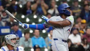 Toronto Blue Jays' Jesús Sánchez hits an RBI sacrifice fly during the first inning of a baseball game against the Milwaukee Brewers, Wednesday, April 15, 2026, in Milwaukee. (Aaron Gash/AP)