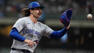 Toronto Blue Jays' Dylan Cease catches the ball at first base to force an out during the second inning of a baseball game against the Milwaukee Brewers, Wednesday, April 15, 2026, in Milwaukee. (Aaron Gash/AP)