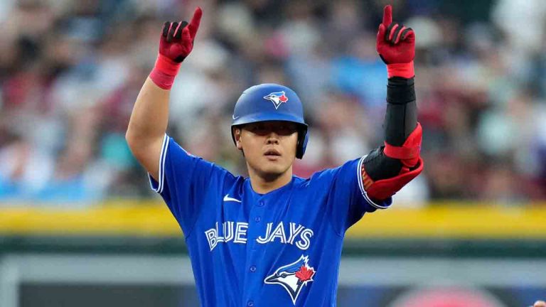 Toronto Blue Jays Kazuma Okamoto, of Japan, stands at second base after his run-scoring single, as he advances to second base on a throw to home plate, during the sixth inning of a baseball game against the Arizona Diamondbacks, Saturday, April 18, 2026, in Phoenix. (Ross D. Franklin/AP)