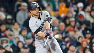 New York Yankees' Giancarlo Stanton hits a two run double during the sixth inning of a baseball game, on Tuesday, April 21, 2026, in Boston. (CJ Gunther/AP)