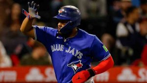 Toronto Blue Jays' Vladimir Guerrero Jr. (27) reacts after scoring on a sacrifice fly from Toronto Blue Jays designated hitter Eloy Jimenez (74) during the sixth inning of a baseball game against the Los Angeles Angels, Tuesday, April 21, 2026, in Anaheim, Calif. (Caroline Brehman/AP)
