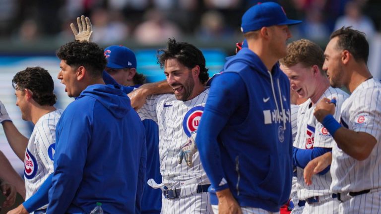 Chicago Cubs' Dansby Swanson, center, celebrates with teammates after driving in the game-winning run in the 10th inning of a baseball game against the Philadelphia Phillies, Thursday, April 23, 2026, in Chicago. (Erin Hooley/AP)