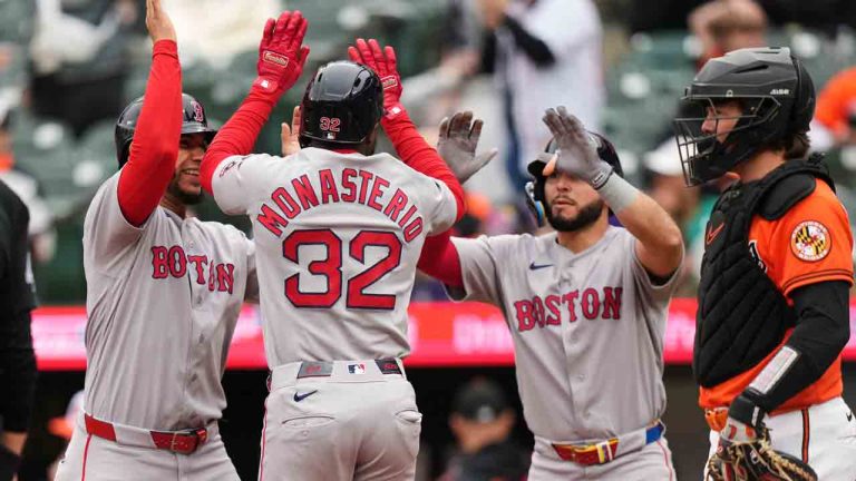 Boston Red Sox' Andruw Monasterio (32) celebrates with Willson Contreras, left, and Wilyer Abreu, third from left, after hitting a grand slam during the ninth inning of a baseball game against the Baltimore Orioles, Saturday, April 25, 2026, in Baltimore. (Stephanie Scarbrough/AP)