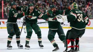 Minnesota Wild players celebrate after their team's win over the Dallas Stars during overtime of Game 4 in the first round of the NHL Stanley Cup hockey playoffs Saturday, April 25, 2026, in St. Paul, Minn. (Matt Krohn/AP)