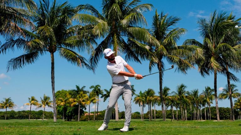 Cameron Young hits along the cart path on the first fairway during the first round of the Cadillac Championship PGA golf tournament Thursday, April 30, 2026, in Doral, Fla. (AP/David J. Phillip)