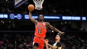 Chicago Bulls forward Leonard Miller (11) goes to the basket past Washington Wizards guard Will Riley, right, during the first half of an NBA basketball game, Thursday, April 9, 2026, in Washington. (Nick Wass/AP)