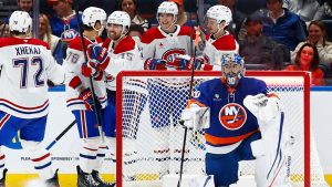 Montreal Canadiens centre Alex Newhook (15) celebrates after scoring a goal against New York Islanders goaltender Ilya Sorokin (30) during the second period of an NHL hockey game, Sunday, April 12, 2026, in Elmont, N.Y. (Noah K. Murray/AP)