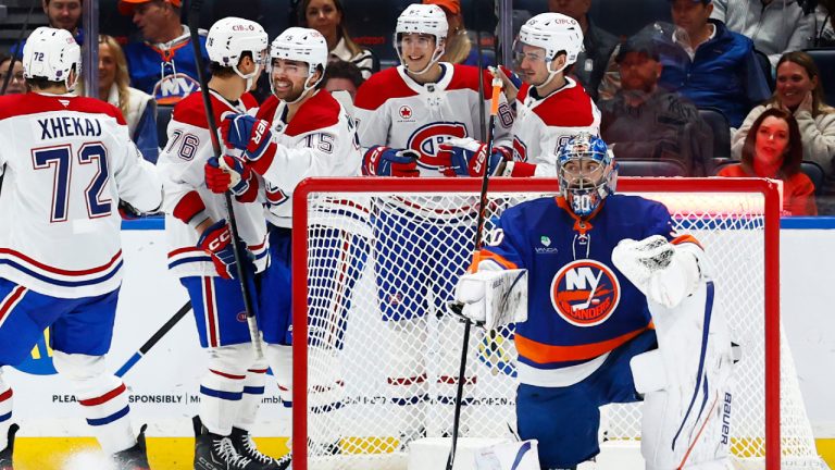 Montreal Canadiens centre Alex Newhook (15) celebrates after scoring a goal against New York Islanders goaltender Ilya Sorokin (30) during the second period of an NHL hockey game, Sunday, April 12, 2026, in Elmont, N.Y. (Noah K. Murray/AP)