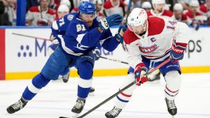 Montreal Canadiens centre Nick Suzuki (14) gets around Tampa Bay Lightning defenceman Erik Cernak (81) during the first period in Game 1 of an NHL hockey Stanley Cup first-round playoff series, Sunday, April 19, 2026, in Tampa, Fla. (Chris O'Meara/AP)