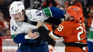 Vancouver Canucks centre Curtis Douglas, left, fights against Anaheim Ducks left wing Jeffrey Viel during the first period of an NHL hockey game, Sunday, April 12, 2026, in Anaheim, Calif. (Kyusung Gong/AP)