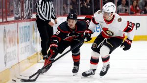 Carolina Hurricanes' Sebastian Aho (20) battles with Ottawa Senators' Tim Stützle (18) for the puck during the second period of Game 2 of an NHL hockey Stanley Cup first-round playoff series in Raleigh, N.C., Monday, April 20, 2026. (Karl DeBlaker/AP)