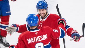 Montreal Canadiens' Alexandre Carrier (45) celebrates his goal over the Minnesota Wild with teammate Mike Matheson (8) during first period NHL hockey action in Montreal on Tuesday, Jan. 20, 2026. (Christinne Muschi/CP)