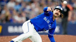 Toronto Blue Jays pitcher Dylan Cease (84) misses the grounder from Boston Red Sox right fielder Roman Anthony as he tumbles off the mound, allowing a run to score during fifth inning MLB baseball action in Toronto on Monday, April 27, 2026. THE CANADIAN PRESS/Frank Gunn