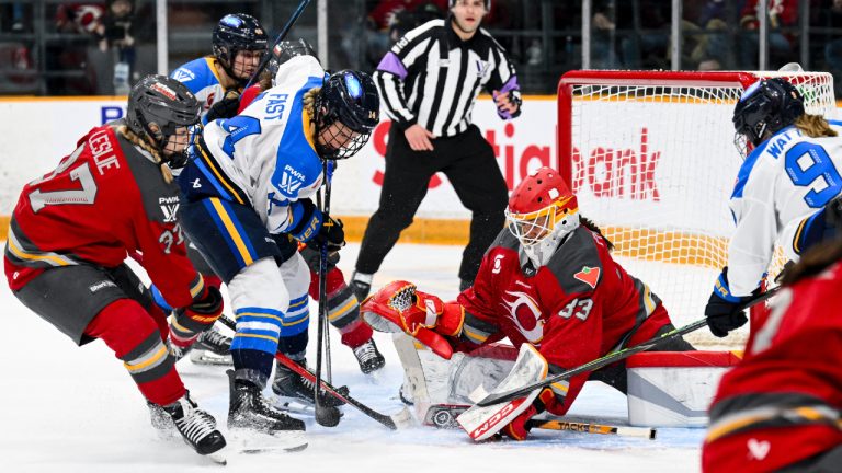 Toronto Sceptres' Renata Fast (14) looks for a rebound as Ottawa Charge's goaltender Gwyneth Philips (33) tries to cover the loose puck during second period PWHL hockey action in Ottawa, on Saturday, April 25, 2026. (Spencer Colby/CP)
