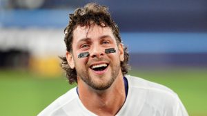 Toronto Blue Jays third baseman Ernie Clement (22) smiles after getting soaked by teammates after hitting a game-winning RBI single during eleventh inning MLB baseball action against the Athletics, in Toronto on Saturday, March 28, 2026. (Frank Gunn/CP)