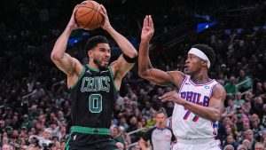 Boston Celtics forward Jayson Tatum (0) drives to the basket against Philadelphia 76ers guard Vj Edgecombe (77) during the first half of Game 5 of a first-round NBA playoffs basketball series, Tuesday, April 28, 2026, in Boston. (Charles Krupa/AP)