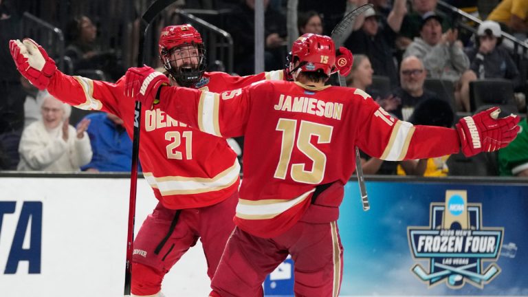 Denver defenceman Kent Anderson (21) celebrates after scoring against the Michigan in the second overtime of a semifinal game in the NCAA Frozen Four men's college hockey tournament Thursday, April 9, 2026, in Las Vegas. (John Locher/AP)