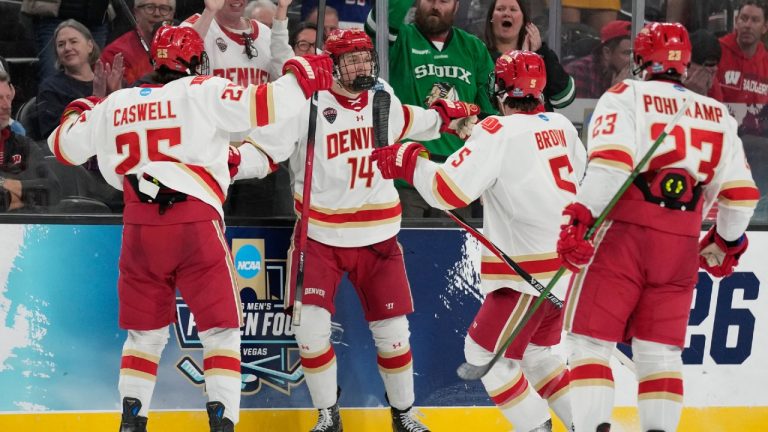 Denver forward Rieger Lorenz (14) celebrates after scoring against Wisconsin in the third period of the championship game at the NCAA Frozen Four men's college hockey tournament Saturday, April 11, 2026, in Las Vegas. (John Locher/AP)