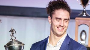 McGill University Redbirds' Eloa Latendresse-Regimbald accepts the Peter Gorman Trophy for the USports football rookie of the year at the Vanier Cup USports awards banque, (Geoff Robins/THE CANADIAN PRESS)