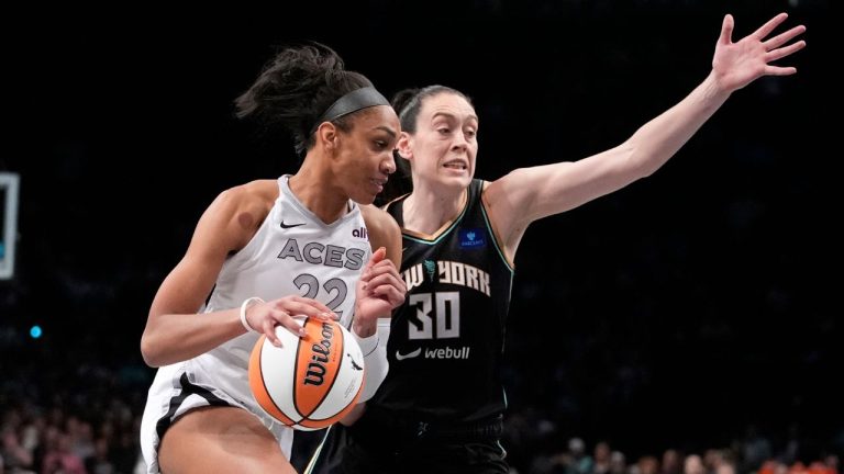 New York Liberty's Breanna Stewart (30) defends Las Vegas Aces' A'ja Wilson (22) during the second half of a WNBA basketball semifinal game, Tuesday, Oct. 1, 2024, in New York. (Frank Franklin II/AP)