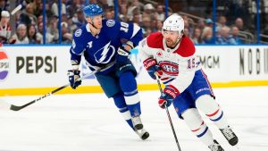 Montreal Canadiens centre Alex Newhook (15) works around Tampa Bay Lightning right wing Corey Perry (10) during the first period in Game 5 of an NHL hockey Stanley Cup first-round playoff series, Wednesday, April 29, 2026, in Tampa, Fla. (Chris O'Meara/AP)