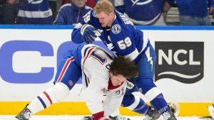 Tampa Bay Lightning centre Jake Guentzel (59) and Montreal Canadiens centre Jake Evans (71) fight during the first period in Game 2 of an NHL hockey Stanley Cup first-round playoff series, Tuesday, April 21, 2026, in Tampa, Fla. (AP Photo/Chris O'Meara)