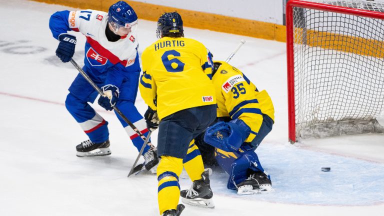 Slovakia's Daniel Jencko (17) scores on Sweden goaltender Melker Thelin (35) as teammate Axel Hurtig (6) works on defence during third period IIHF World Junior Hockey Championship preliminary round action in Ottawa, Thursday, Dec. 26, 2024. (Spencer Colby/CP)
