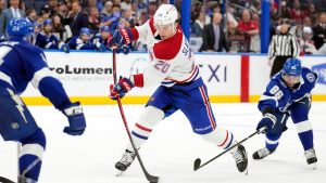 Montréal Canadiens left wing Juraj Slafkovský (20) prepares to score after getting around Tampa Bay Lightning right wing Nikita Kucherov (86) during the third period of an NHL hockey game Sunday, Dec. 28, 2025, in Tampa, Fla. (Chris O'Meara/AP)
