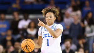 UCLA guard Kiki Rice (1) gestures while dribbling against Oklahoma State during the second half in the second round of the NCAA college basketball tournament, Monday, March 23, 2026, in Los Angeles. (AP Photo/Jessie Alcheh)