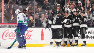 Los Angeles Kings right wing Joel Armia, second from left, celebrates his goal with teammates as Vancouver Canucks goaltender Nikita Tolopilo stands in goal during the first period of an NHL hockey game Thursday, April 9, 2026, in Los Angeles. (Mark J. Terrill/AP)