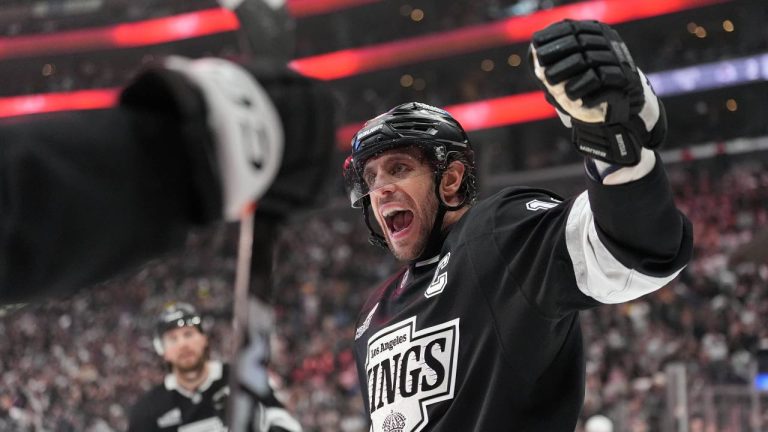 Los Angeles Kings' Anze Kopitar (11) celebrates a goal by Joel Edmundson against the Colorado Avalanche during the second period of Game 4 in the first round of an NHL hockey Stanley Cup playoff series Sunday, April 26, 2026, in Los Angeles. (Scott Strazzante/AP)