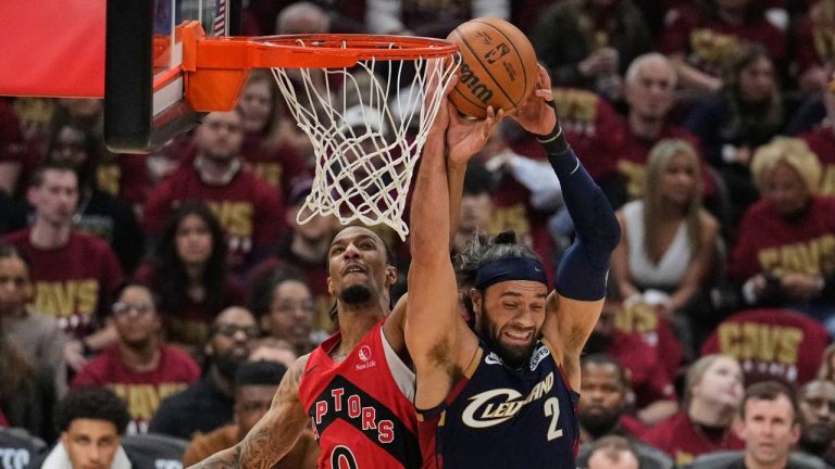 Cleveland Cavaliers guard Max Strus (2) grabs a rebound next to Toronto Raptors guard A.J. Lawson (0) in the first half in Game 2 of a first-round NBA basketball playoffs series in Cleveland, Monday, April 20, 2026. (Sue Ogrocki/AP)