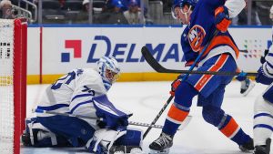 Toronto Maple Leafs goaltender Artur Akhtyamov, left, protects the net from New York Islanders' Calum Ritchie during the second period of an NHL hockey game Thursday, April 9, 2026, in Elmont, N.Y. (Frank Franklin II/AP)