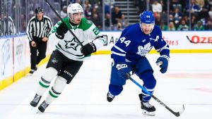 Toronto Maple Leafs defenceman Morgan Rielly (44) and Dallas Stars right wing Arttu Hyry (25) race for a puck during first period NHL hockey action in Toronto, Monday, April 13, 2026. (Cole Burston/CP)