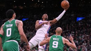 Philadelphia 76ers guard Tyrese Maxey (0) drives to the basket against the Boston Celtics during the second half of Game 2 of a first-round NBA playoffs basketball series, Tuesday, April 21, 2026, in Boston. (AP Photo/Charles Krupa)