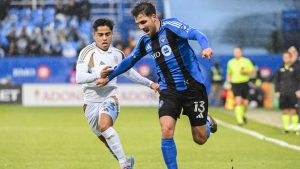 CF Montreal's Luca Petrasso (13) holds off a challenge from Los Angeles FC's Frankie Amaya during first half MLS soccer action in Montreal, Saturday, May 24, 2025. (Graham Hughes/CP)