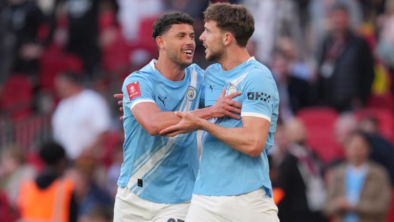 Manchester City's Matheus Nunes hugs Nico Gonzalez after he scorred during the FA Cup semifinal soccer match between Manchester City and Southampton in Manchester, England, Saturday, April 25, 2026. (AP Photo/Kin Cheung)