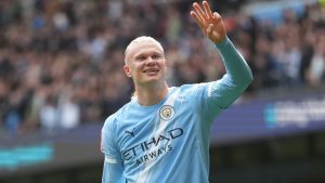 Manchester City's Erling Haaland celebrates after scoring his third goal during the FA Cup quarter-final soccer match between Manchester City and Liverpool in Manchester, England, Saturday, April 4, 2026. (AP Photo/Jon Super)