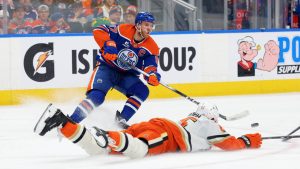 Anaheim Ducks’ Jacob Trouba (65) slides in front of Edmonton Oilers’ Connor McDavid (97) during second period NHL action, in Edmonton on Saturday March 28, 2026. (James Maclennan/CP)
